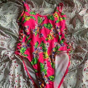 Pink bathing suit with tropical flowers